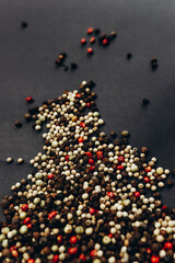 A peppercorn mix on a black background 