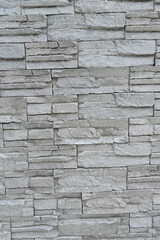 closeup the bunch grey brown stone wall soft focus natural grey brown background.