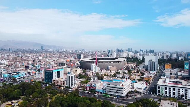 Video of the National Stadium of Lima along with the cityscape of the city. Video from a drone.