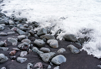Volcanic Rocks of the Hawaiian Coast in the Raging Waters of the Ocean