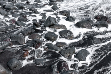 View of Hawaii's Volcanic Coastline at High Tide