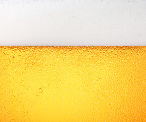 Close up background of beer with bubbles in glass - 584397500