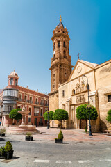 Fototapeta na wymiar Antequare, SPAIN: June 14 2022: Panoramic view of San Sebastian Square with the old church 