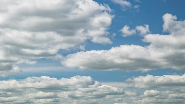 Cloudscape timelapse. Blue sky with white fluffy clouds. Time lapse video
