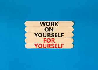 Work for yourself symbol. Concept words Work on yourself for yourself on wooden stick. Beautiful blue table blue background. Business and work for yourself concept. Copy space.