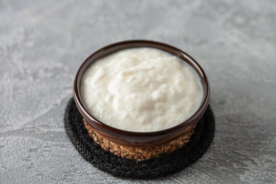 Plain curd or yogurt or Dahi. Traditional Indian fermented milk sauce