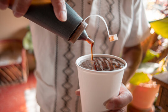 hands of man close up preparing bat a traditional drink from Comala Colima Mexico