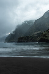 Famous volcanic black sand beach in Seixal, Madeira at dramatic cloudy weather