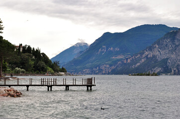 View of Lake Garda with Mountains and Timber  Jetty