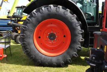 Deurstickers Large Wheel and Tire in Close Up of Agricultural Tractor  © eyepals