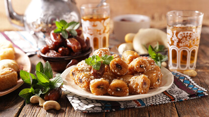 Ramadan food- assorted of pastry,  dried dates and mint tea