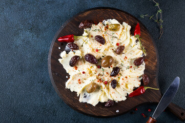 Homemade Trendy Butter Board with Herbs and Bread. Butter board with herbs and olives. Trendy food. Trendy appetizer