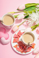 Valentine's Day romantic concept. Morning coffee, a bouquet of tulips, symbolic decor