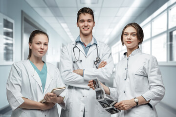 Fototapeta premium Portrait of Joyful crew of male and two female doctors working together in hospital.