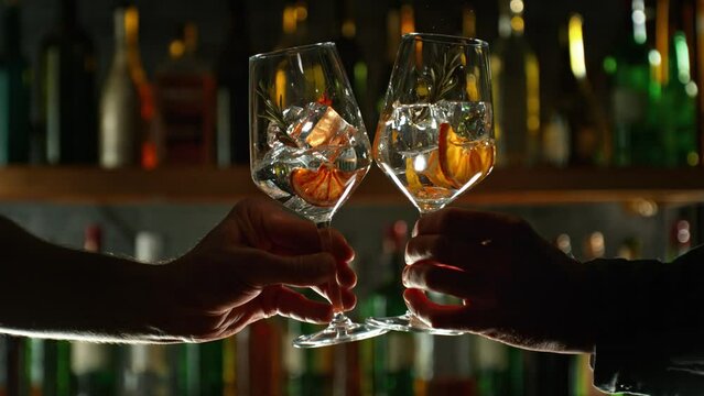 Super Slow Motion Shot of Cheering with Two Drinks Before Bar at 1000fps.