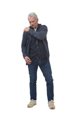 full length portrait of a man in shoulder pain in isolated on white