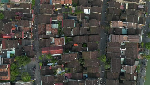 Hoi An rooftop high 3-7 - Aerial drone footage above the old iconic city of Hoi An, Vietnam. Under Unesco Heritage since 1985 this beautiful town attracts thousand tourists daily