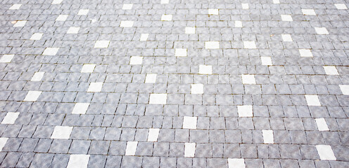 Abstract background of cobblestone pavement close-up