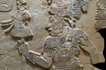 Maya bas relief carving in a stele tombstone of mayan ruler king, Palenque, Mexico.