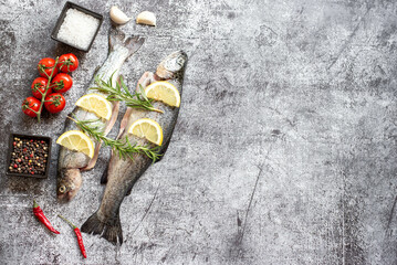 raw trout with spices on stone background with copy space for your text