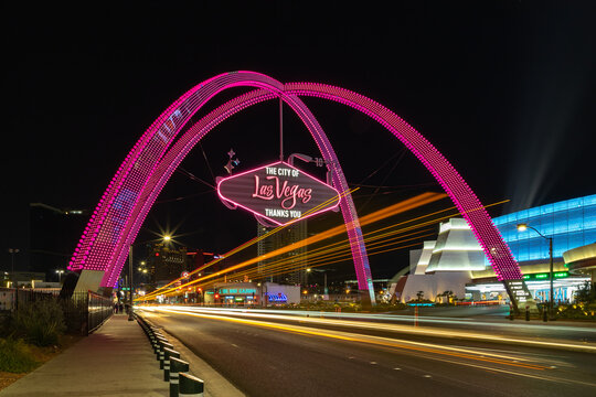 Las Vegas, United States - November 22, 2022: A picture of the Las Vegas Boulevard Gateway Arches at night, with some light painting from nearby traffic.