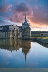 Fototapeta na wymiar Chantilly castle, in France, beautiful palace with a lake 