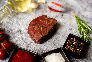 raw beef steak on stone background