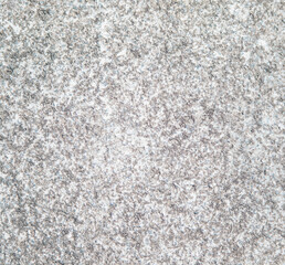 The texture of marble. The stone floor is made of gray marble chips.