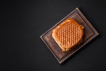 Delicious crispy sandwich with chicken breast, tomatoes, ketchup and spices