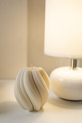 The candle is on the table