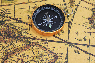 Naklejka na ściany i meble Classic round compass on background of old vintage map