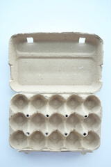 egg carton without eggs on table ,