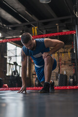 Male boxer training fit man doing boxing in gym young man doing warm up stretching muscles