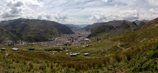 HUANCAVELICA, PERU - MARCH 23, 2023: Panoramic view of the city of Huancavelica from the foot of Cerro Tesorero. Photograph taken behind the most distant houses.