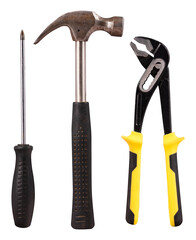 Tools necessary for small household repairs. Screwdriver, hammer and wrench on an isolated background.
