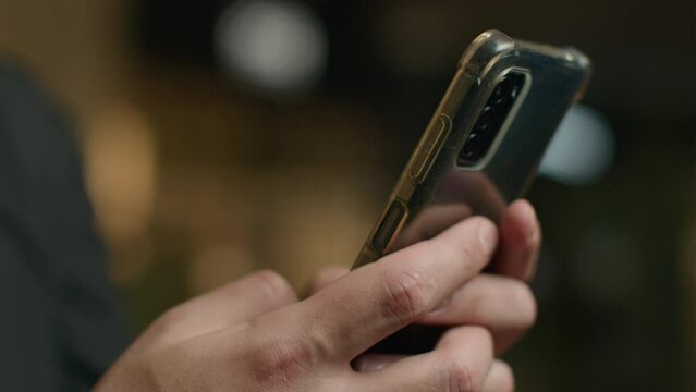 Close-up male hands chatting cellphone screen typing message touchscreen on mobile phone unrecognizable man businessman texting smartphone make online order buy internet purchases using digital apps