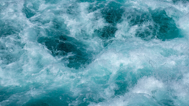 Water texture. Huka Falls, Taupo, New Zealand.

Huka Falls is a set of waterfalls along the Waikato River, which drain Lake Taupō. Water rushes through the falls creating a series of violent rapids.