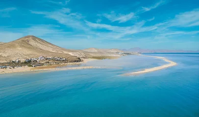 Crédence en verre imprimé Plage de Sotavento, Fuerteventura, Îles Canaries Stunning low level aspect aerial panoramic view of the beautiful tropical looking beach, lagoon and sand dunes at Sotavento Risco del Paso beach near Costa Calma on Fuerteventura Canary Islands Spain