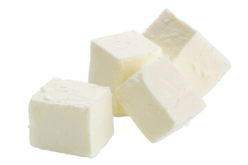 Cubes of feta cheese are isolated on a white background. 