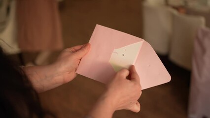 Put the greeting card in an envelope