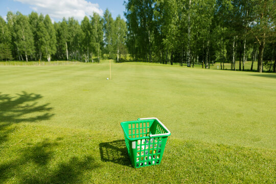 golf balls in basket on the golf course