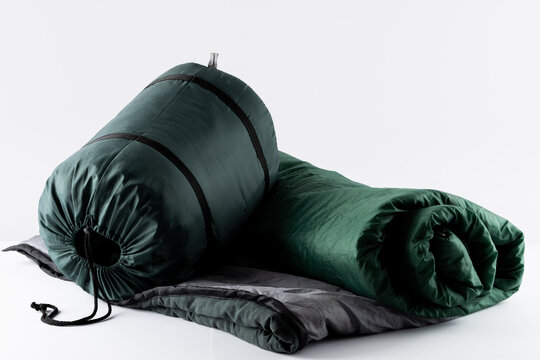 Close up of sleeping bag on white background with copy space