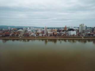 Fototapeta na wymiar Aerial drone view of city along river. 