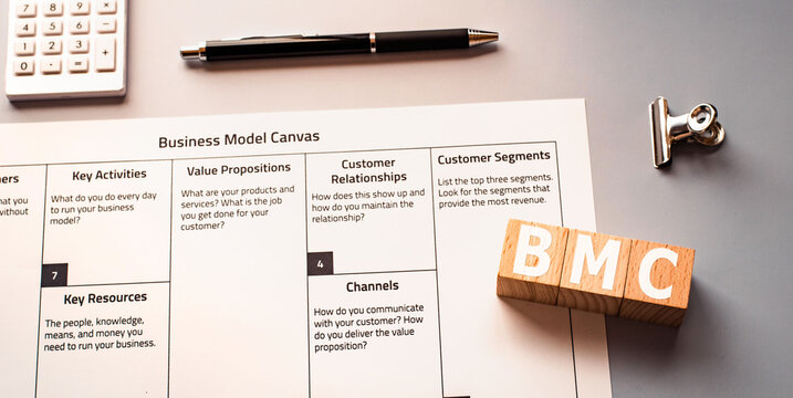 There is wood cube with the word BMC. It is eye-catching image.