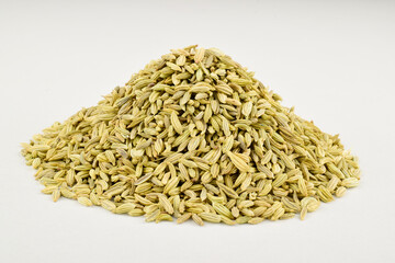 Aromatic fennel seeds on white background, aromatic spice