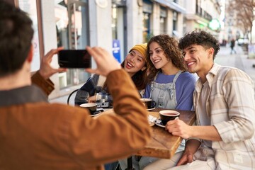 Coffee time with friends from around the world, capturing memories with a selfie