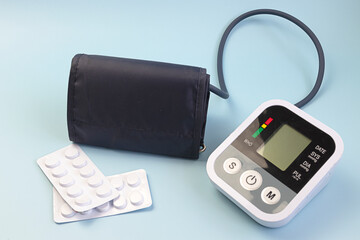 Medical tonometer for measuring blood pressure on blue background. Health care and Medical concept