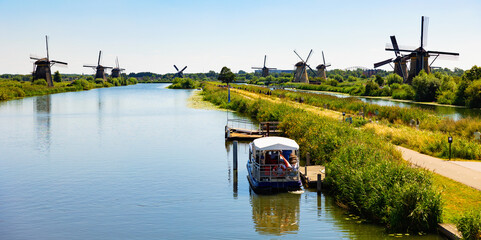 Fototapeta na wymiar Summer landscape overlooking the windmills in Kinderdijk, UNESCO World Heritage Site, Netherlands