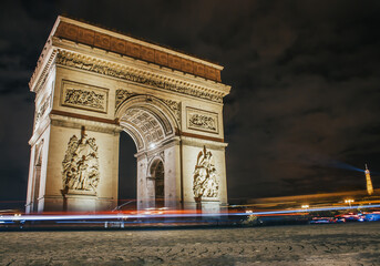 arc de triomphe at night in Paris, France