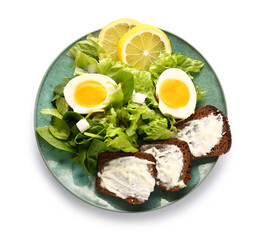 Plate of delicious salad with boiled eggs and cream cheese sandwiches isolated on white background